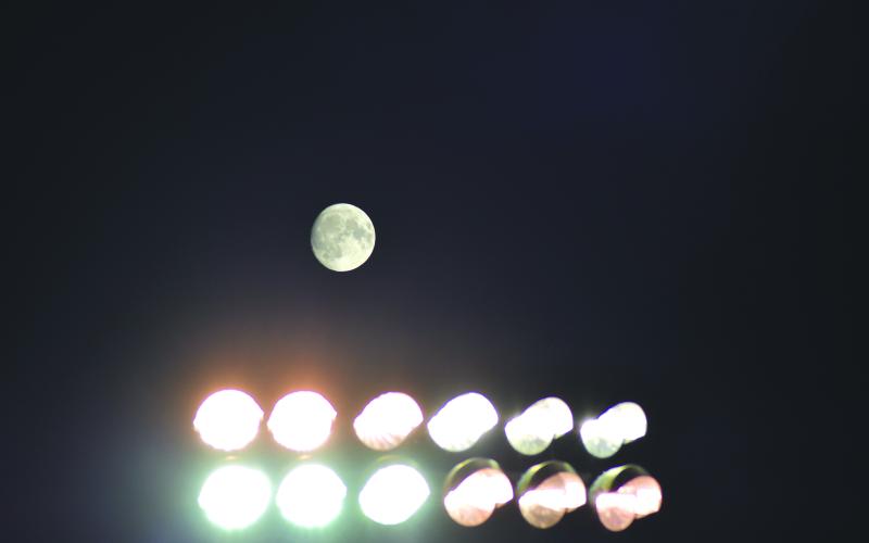 Enoch Autry/The Clayton Tribune. As late Sunday rolls into early Monday, a full moon can be seen above the light standards at Frank Snyder Memorial Stadium for Midnight Madness for the Rabun County Wildcat fooball team.
