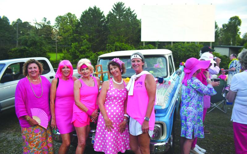Enoch Autry/The Clayton Tribune. Caroline Wallis, F.A.I.T.H. executive director, (far right of group) stands with others donning lots of pink.