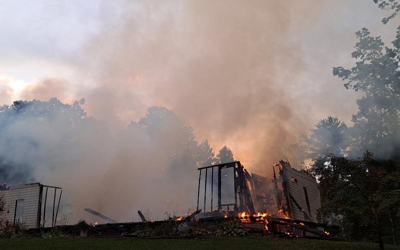Megan Horn/The Clayton Tribune. Rabun County firefighters battle a structure fire on Sidetrack Lane on Aug. 27.