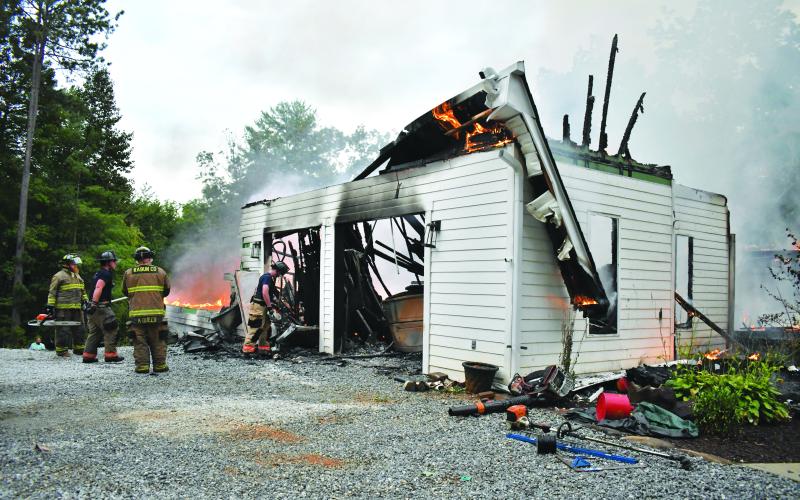 Megan Horn/The Clayton Tribune. Rabun County firefighters battle a structure fire on Sidetrack Lane on Aug. 27. 