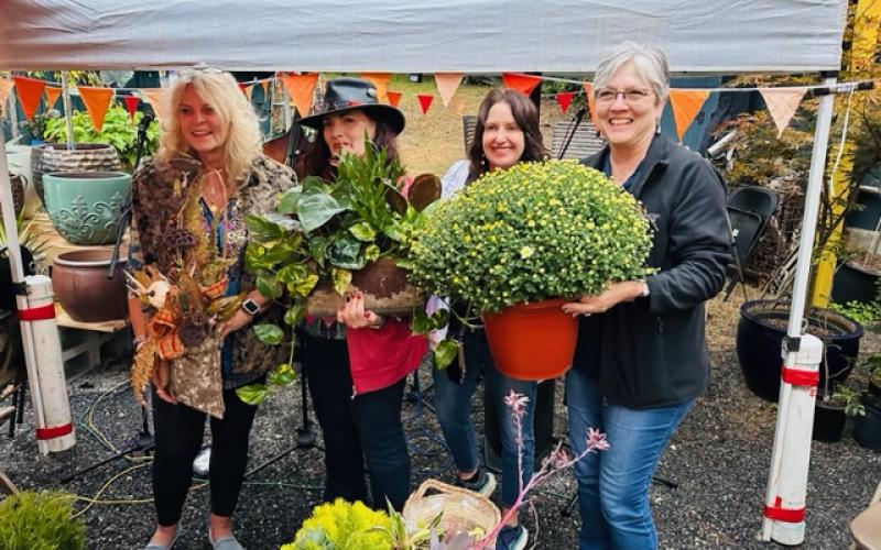 Photo courtesy Forward Rabun/Rabun County Chamber of Commerce. Those in attendance at the open house event bought some of the beautiful garden items at the Lakemont garden business.