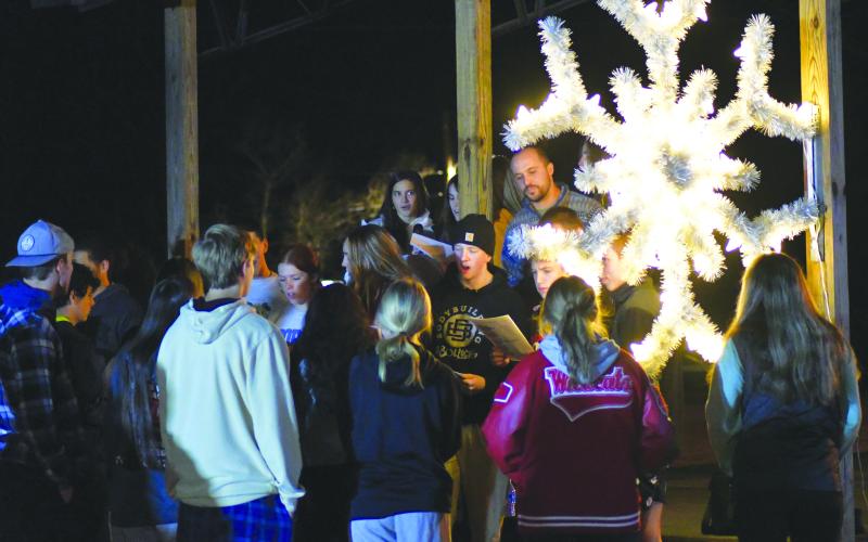 Enoch Autry/The Clayton Tribune. The community enjoys caroling from students from Head of Tennessee Baptist Church during the Dillard Tree Lighting Ceremony. 