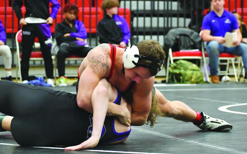 Wade Cheek/The Clayton Tribune. Rabun County’s Noah English pins his 165-pound opponent from Walhalla during the RCHS wrestling teams’ first home meet on Dec. 5. The Wildcats fell to Walhalla 48-32 but defeated 45-24.