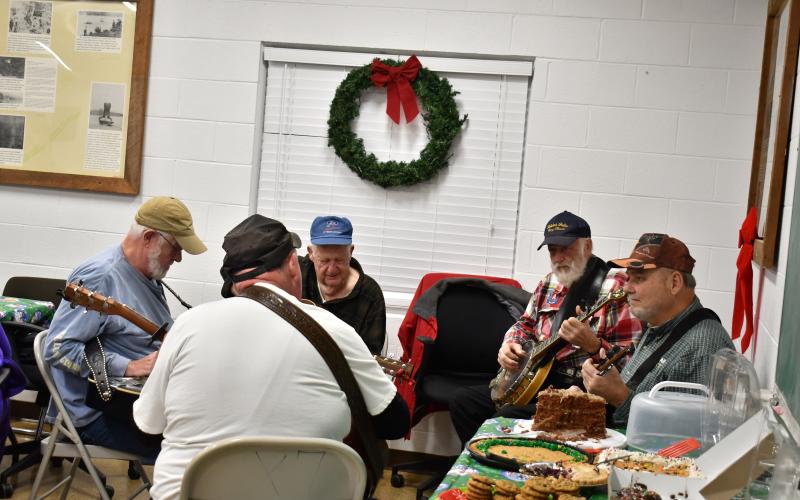 Megan Horn/The Clayton Tribune.  Visitors enjoyed an evening of caroling and bluegrass music in Tallulah Falls as the town celebrated Christmas with its annual party. 