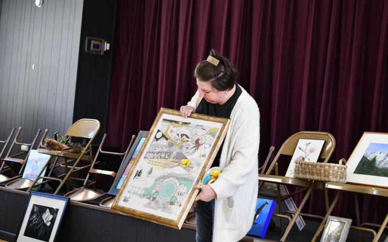 Megan Horn/The Clayton Tribune. Illustrator Gretchen Roach showcased her skills with mixed-medium and displayed scenes from “The Lord of the Rings” and “The Hobbit.” 