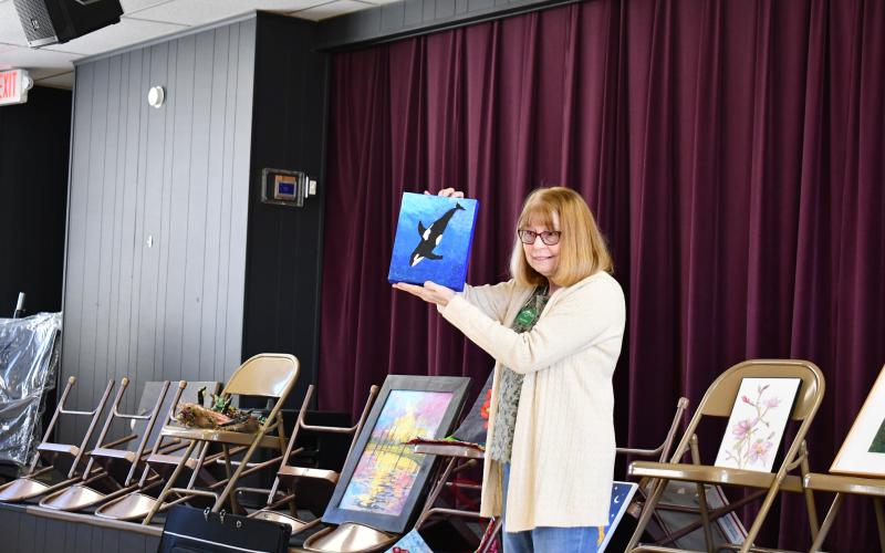 Megan Horn/The Clayton Tribune. Tanya Barton was inspired by the movie “Free Willy” in her beautiful art piece depicting a whale in an ocean of blues. 