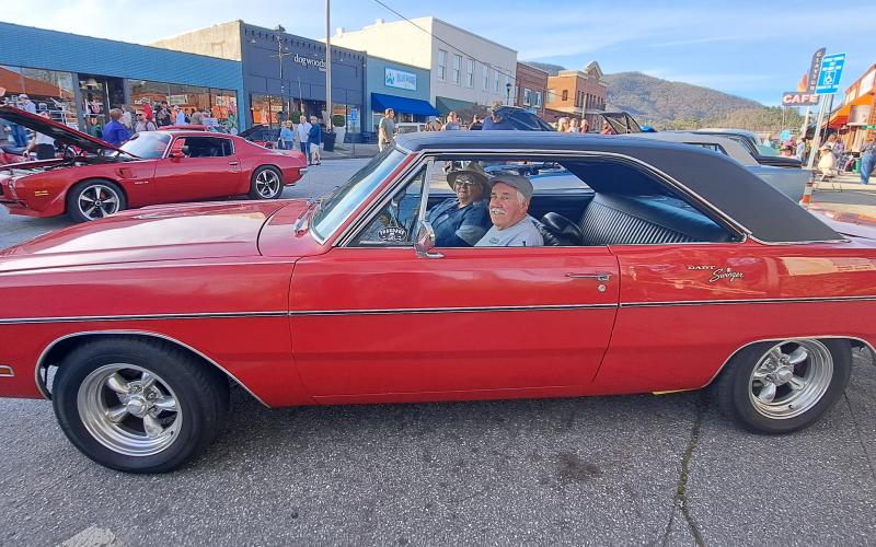 Megan Horn/The Clayton Tribune. Charles and Judy Hartley cruised their 1970 Dodge Dart Swinger to downtown Clayton for the CMBA block party on March 16. 