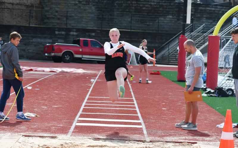 Wade Cheek/The Clayton Tribune. RCHS freshman Kenlee Hedge earns a personal-record during the triple jump at the ninth-annual Bo James Invitational that was hosted by the RCHS track and field team last Saturday, March 23. 
