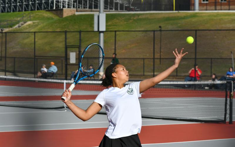 Wade Cheek/The Clayton Tribune. TFS singles player Jaeda-Lee Daniel-Joseph sets her sights on a serve during a region match against Rabun County High School. Daniel-Jones and the Lady Indians advanced to the Region 8 title game after defeating Commerce.