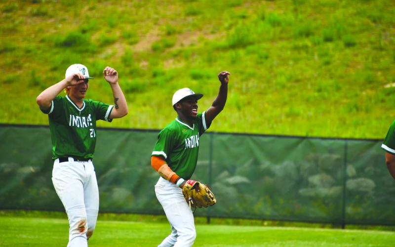 Wade Cheek/The Clayton Tribune. Indian senior Chris Waldron (right) waves farewell to their opponents of Swainsboro after the Tallulah Falls School eliminated the visiting Tigers from the Georgia Class A DI tournament on Tuesday, May 7, in the Elite Eight.