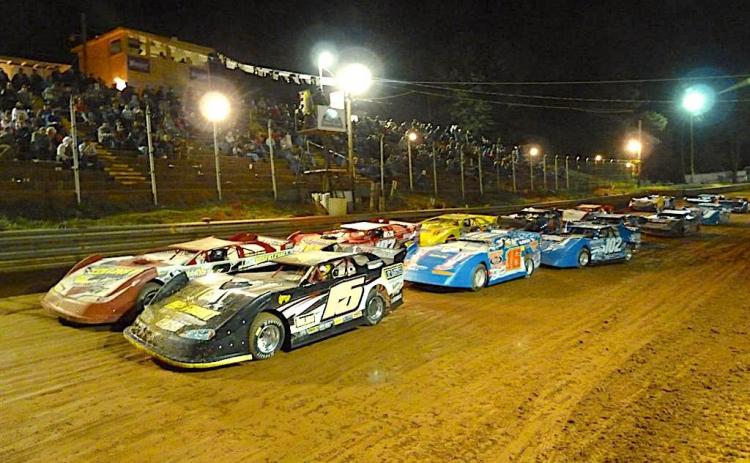 Cars running two across roar down the straightaway during a feature race at Toccoa Raceway.Photo racingin.com
