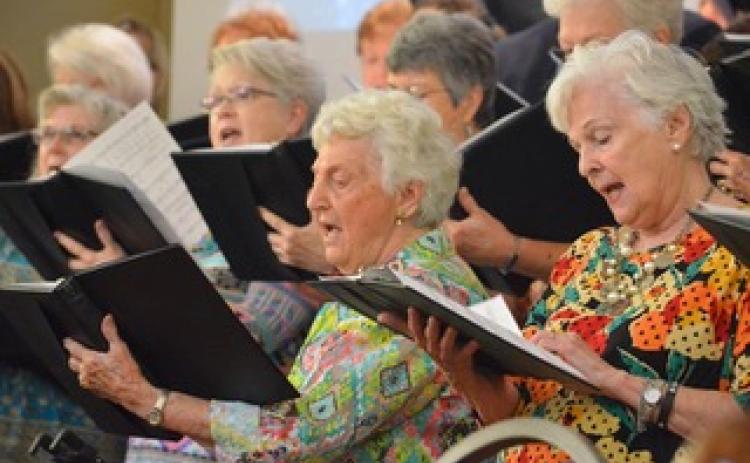 Wayne Knuckles/The Clayton Tribune. Kathleen Arbitter and Linda Brandsma join the rest of the choir in song as Clayton Baptist Church celebrated their 200th anniversary Sunday. 