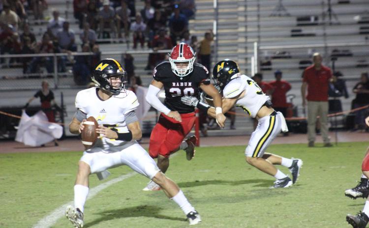 Rabun County linebacker Hoffman Windham (30) pursues North Murray quarterback Ladd McConkey during the first half at Frank Snyder Memorial Stadium in Tiger on Aug. 30. (Glendon Poe/The Clayton Tribune)