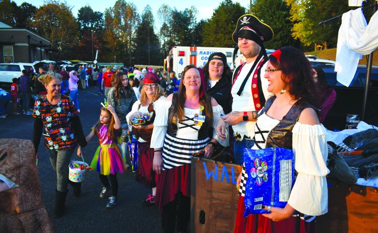 Enoch Autry/The Clayton Tribune. Employees from Walmart changed things up as these pirates gave out candy instead of taking.