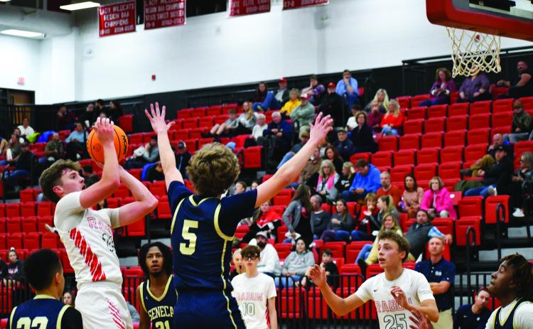 Luke Morey/The Clayton Tribune. Junior Cooper Welch hits a jumper against Seneca on Thursday. Welch will be leading the team as the sole returning starter to the squad. 