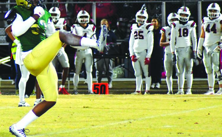 Enoch Autry/The Clayton Tribune. Eagle junior Gideon Herbert reacts to a sack in a prior game against Providence Day. The playoffs start Friday at home.