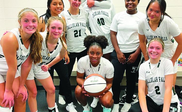 TFS Athletics. Senior Denika Lightbourne (center) poses with her TFS teammates after scoring 1,000 points in her career. She now holds three school records as well as being the fifth Lady Indian to score 1,000 points.