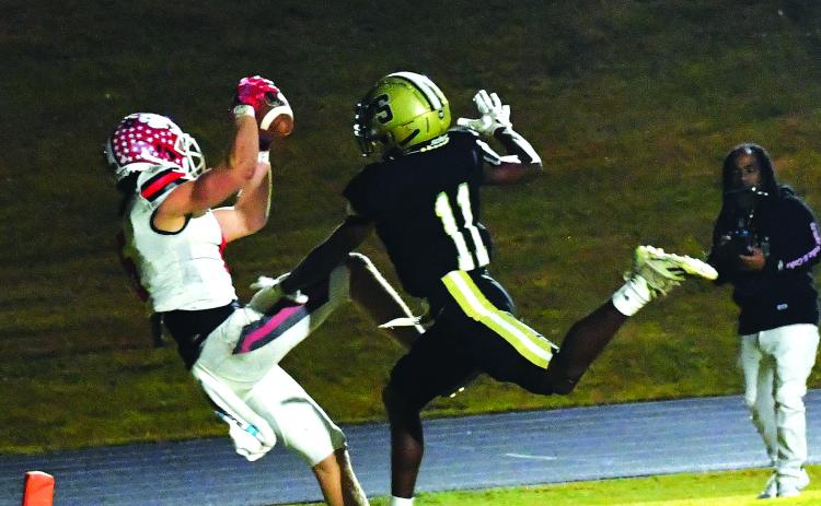 Luke Morey/The Clayton Tribune. Rabun County senior receiver Jaden Gibson gets his left foot down in the end zone for a receiving touchdown over Swainsboro sophomore Qindaruis Brown. This Gibson TD establishes a new state single-season touchdown reception total with 29 to surpass former RCHS receiver Adriel Clark’s 28 in 2020.