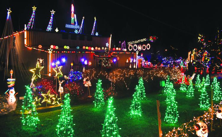Megan Broome/The Clayton Tribune. The Christmas Village of Lights provided by the local nonprofit Fight Abuse in the Home (FAITH) and Kirk Knous will again light up the sky Friday and Saturday, Dec. 16-17, from 5:30-8:30 p.m. both evenings at 90 Tiger  Connector, Tiger. 