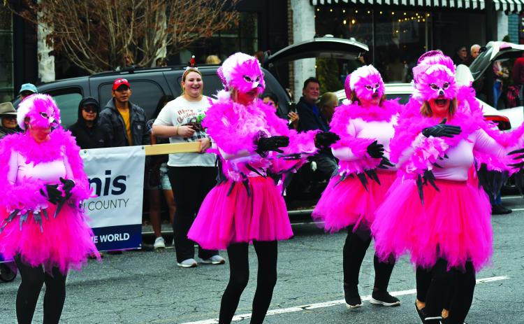 Enoch Autry/The Clayton Tribune. The “Most Original Costumes and Decorations” category winner in the Dec. 3 downtown Clayton Christmas Parade was five female club members dressed as feathery pink dancing flamingos from the Kiwanis Club of Rabun County.