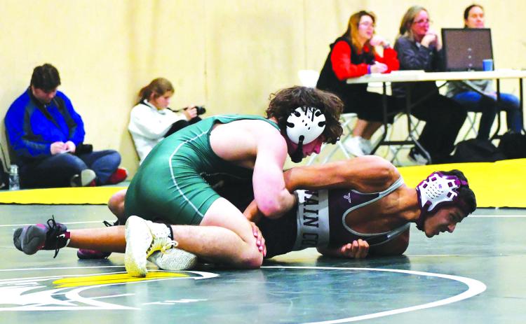 Luke Morey/The Clayton Tribune. Rabun Gap-Nacoochee junior Clay Unruh grapples with Swain County’s Randall Jenkins on his way to a victory on Tuesday, Jan. 10. Unruh is looking to go for back-to-back state titles after winning the 132 title last year.