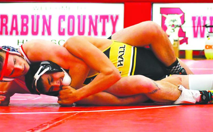 Luke Morey/The Clayton Tribune. Rabun County senior Miles Watts grapples with an East Hall opponent on Tuesday, Jan. 24. Watts looks to compete again in the GHSA state championship after taking state runner-up last year. 