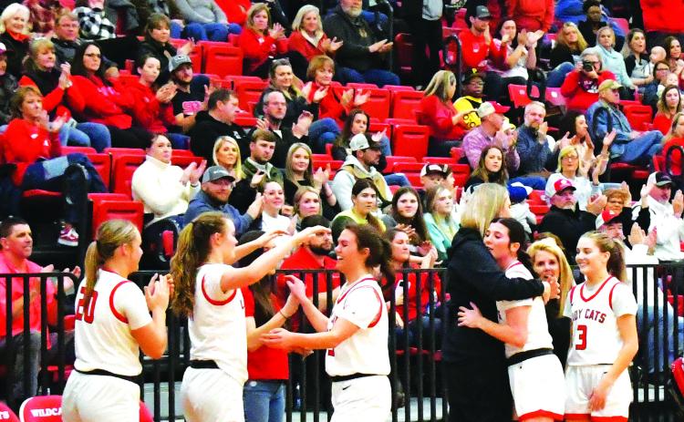 Luke Morey/The Clayton Tribune. The three Lady Cat seniors receive an ovation as they check out of their second to last home game of the regular season. From left, the seniors include Bailey Maloney, Mary Lovell and Trea Blalock. 