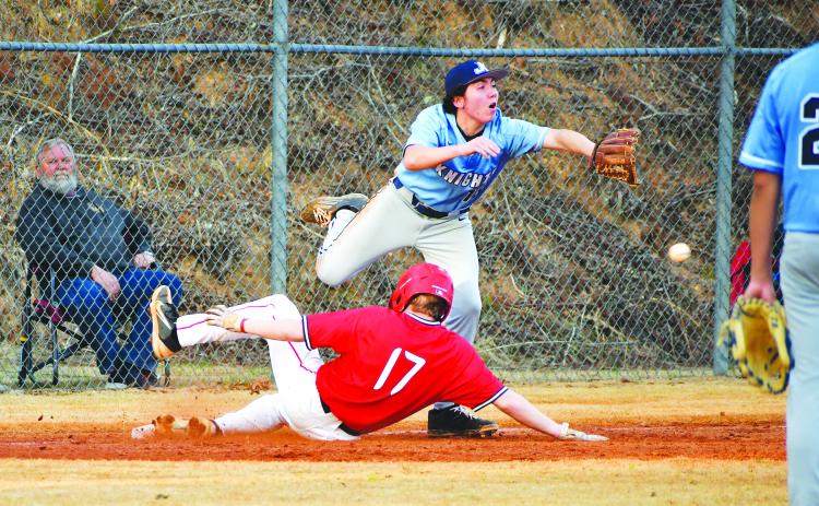 Luke Morey/The Clayton Tribune. RCHS’s Elvis Hunt slides into third base in the second inning against Johnson on Tuesday, Feb. 21. Hunt and the WIldcats won 18-3 for their second victory of the season. The Wildcats next play at Stephens County on Saturday, Feb. 25.