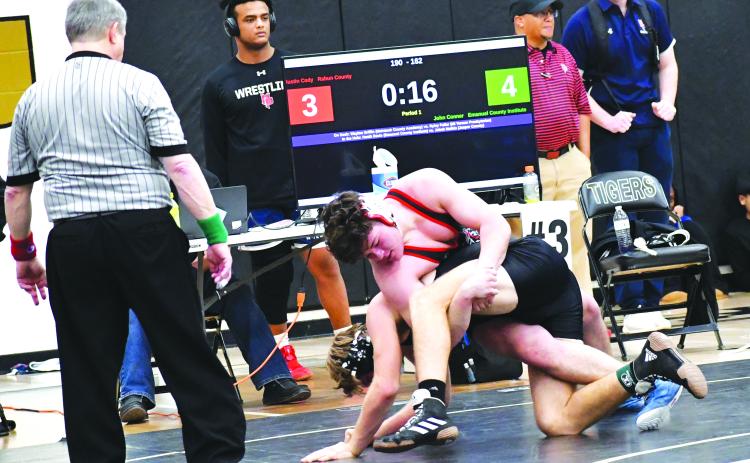 Luke Morey/The Clayton Tribune. Rabun County’s Justin Cody gets control of John Conner from Emanual County Institute during the sectionals tournament on Saturday, Feb. 11. Cody is one of four RCHS wrestlers heading to the State tournament that begins on Thursday, Feb. 16.