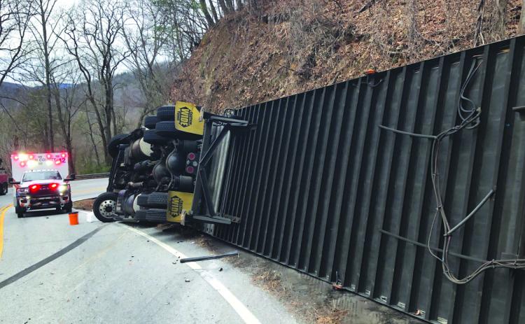 Photo courtesy of Sky Valley Police Chief Vaughn Estes. Emergency personnel work the scene of a crash where a semi-truck hauling gallon jugs of water overturned on Highway 246 near Sky Valley Overlook Wednesday, Feb. 1. 