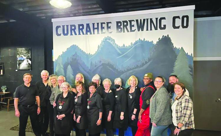Submitted photo. Volunteers at the Currahee Brewing Company nonprofit night March 2 show support to the Food Bank of Northeast Georgia Food 2 Kids Program as the community came out and raised $2,900. 