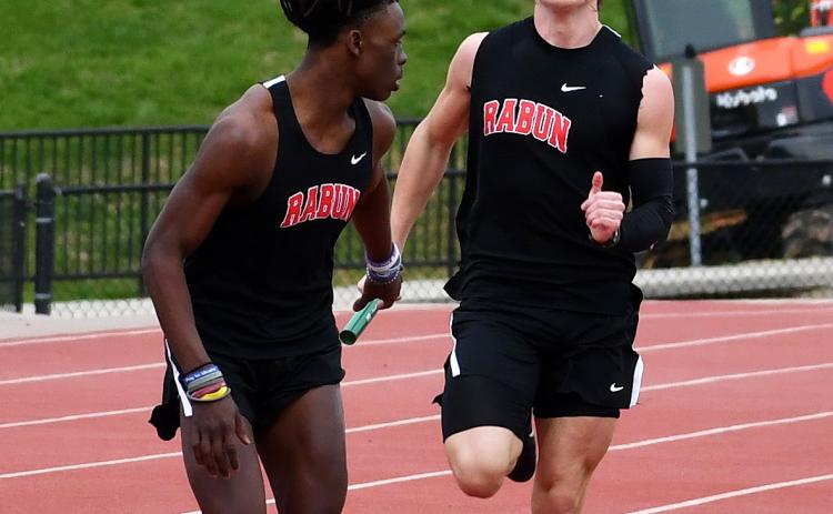 Luke Morey/The Clayton Tribune. RCHS juniors Willie Goodwyn and Paul Picciotti helped the boys 4X400 team take second place at a track meet against Commerce, Athens Christian and Elbert County. Goodwyn and Picciotti were joined by Hayden Deslich and Hayden Smith in the relay.