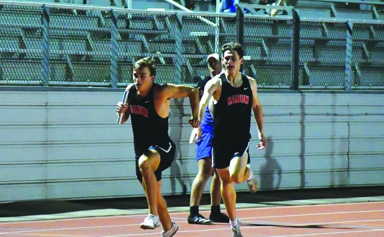 Luke Morey/The Clayton Tribune. Hayden Deslich passes the baton off to Paul Picciotti during the 4X400 on Wednesday, April 19. The relay team of Deslich, Picciotti, Hayden Smith and Willie Goodwyn finished the relay with a time of 3:34.