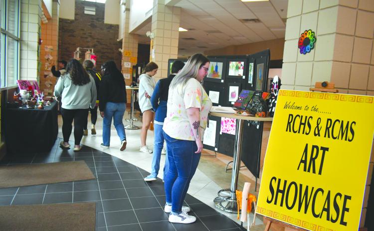 Megan Broome/The Clayton Tribune. Students at Rabun County Schools enjoy viewing the end-of-the-year RCMS/RCHS Art Showcase in the Fine Arts Building (FAB) Friday, May 12. 