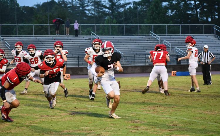 Luke Morey/The Clayton Tribune. Rising Rabun County sophomore Ty Truelove gets the angle on a quarterback keeper against rising sophomore Levi Bartram during the Thursday, May 18, Spring Game. The Wildcats begin their defense of the Class A Division 1 Region 8 title in August.