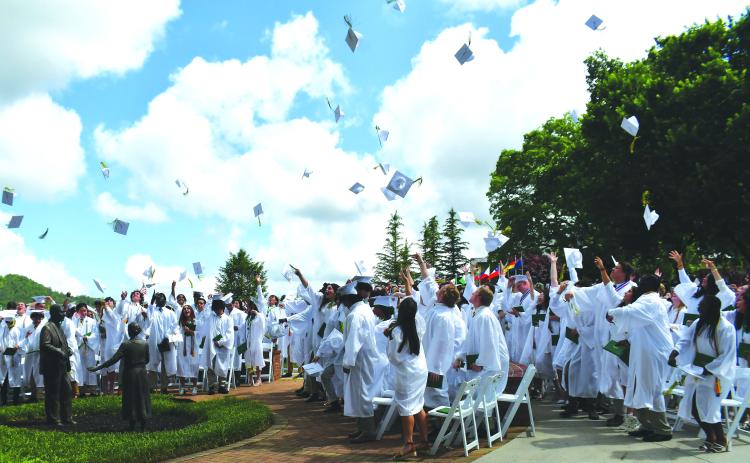 Luke Morey/The Clayton Tribune. The 100 Rabun Gap graduates toss their caps in the air on Sunday, May 21, as they celebrate their graduation. The commencement ceremonies also included a baccalaureate speech, given by Rev. Dr. Jeffry Lynn Reynolds. The Rabun Gap seniors helped achieve two back-to-back state championships as well as the Shuler Award for the arts program, on top of all 100 earning acceptance into a four-year college or university. 