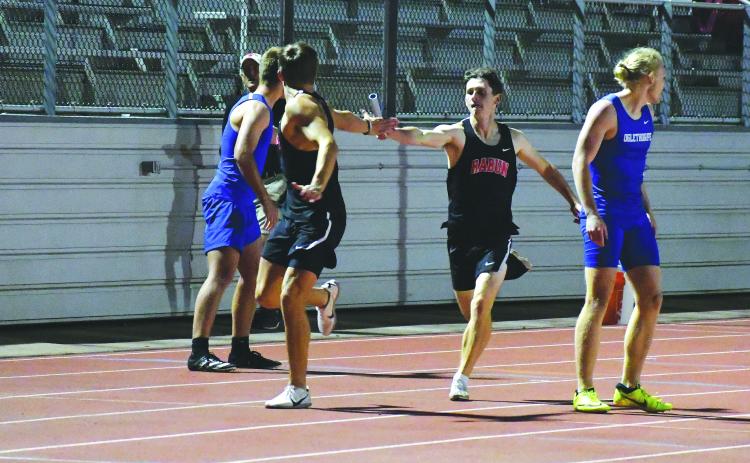 Luke Morey/The Clayton Tribune. In a meet earlier in the season, Hayden Deslich hands off the baton to Rabun County High School 4X400-meter relay teammate Paul Picciotti. The team of Deslich, Picciotti, Hayden Smith and Willie Goodwyn raced to a 3:34.10 in the state Class 1A Division I sectional to set a season record as the Wildcats placed third.