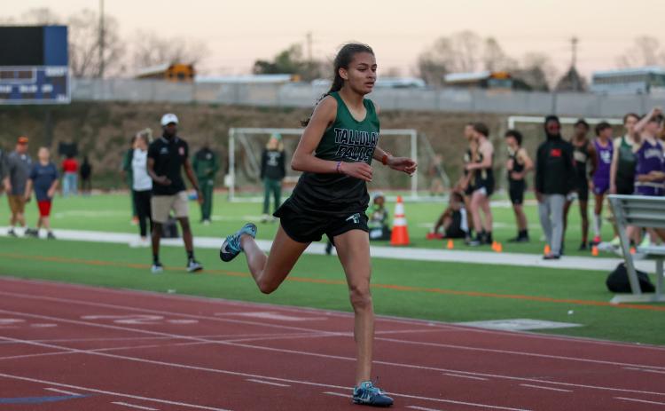 Courtesy of Austin Poffenberger. Julianne Shirley won a region title as she finished first in the 400-meter dash.