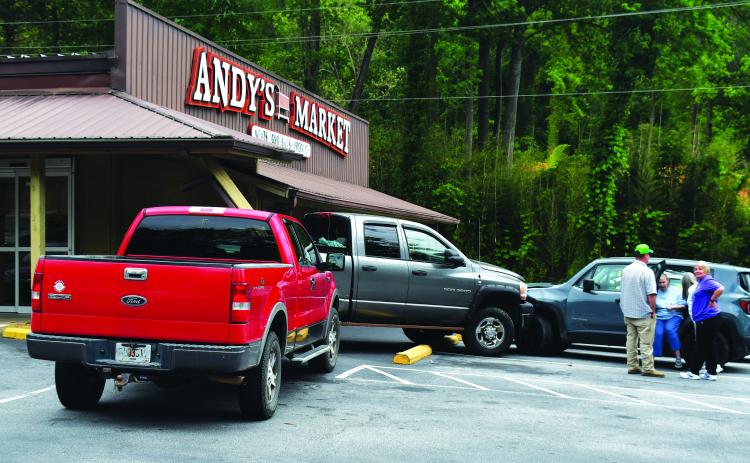 Luke Morey/The Clayton Tribune. Three-vehicle crash also strikes Andy’s Market on May 30 in Clayton.