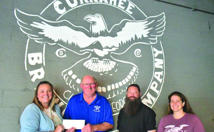Megan Broome/The Clayton Tribune. Nonprofit night at Currahee Brewing Company raised $4,100 for Sid Weber Memorial Cancer Fund. Pictured are Ara Joyce (left); Sid Weber Memorial Cancer Fund President Ken Walton; Scott Mazarky; and Hillary Marshall. 
