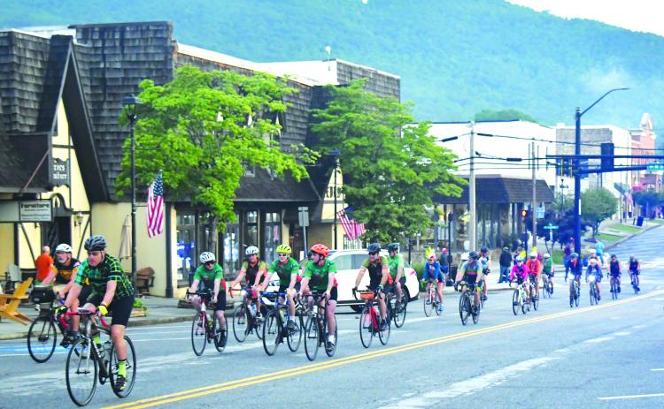 Luke Morey/The Clayton Tribune. Some of the 1,000 cyclists roll on South Main Street on June 4 in Clayton to start the first segment of the BRAG route through Rabun County.