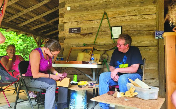 File photo/Megan Broome/The Clayton Tribune. Foxfire’s Kelly Coldren, a fiber artist, demonstrates weaving at the Foxfire Museum in 2022. This year’s event will be June 9 and 10.
