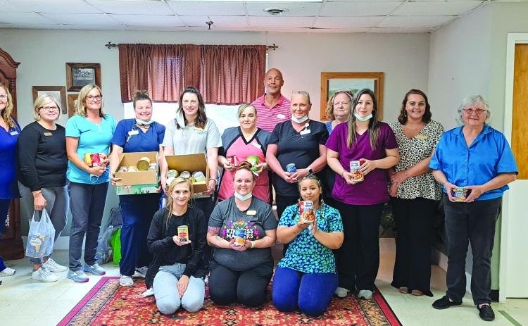 Megan Broome/The Clayton Tribune. Workers at Mountain View Health and Rehabilitation Center in Clayton donate 169 pounds of food to the Food Bank of Northeast Georgia to give back to the community during National Skilled Nursing Care Week. 