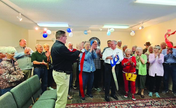 Megan Broome/The Clayton Tribune. City of Sky Valley officials, community members and Forward Rabun/Rabun County Chamber of Commerce cut the ribbon on the new location for Sky Valley City Hall Friday, May 26. 