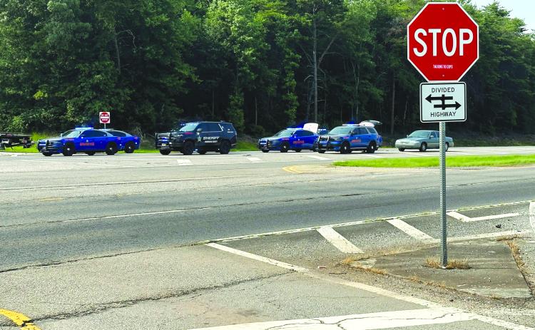 Photo courtesy Habersham County Public Information. Law enforcement vehicles are parked in a line on Sunday, July 16, at the crash scene in Habersham County as five people died.