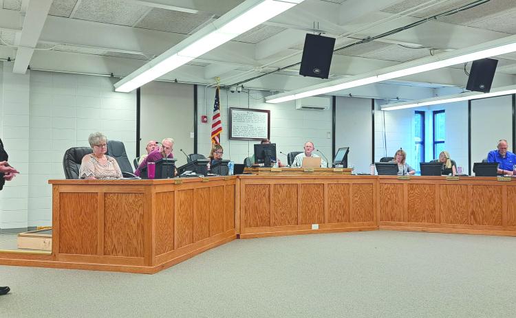 Megan Broome/The Clayton Tribune. Clayton Police Department Chief Andy Strait talks to council members about a new ordinance making it unlawful to make left turns to park in certain areas of downtown Clayton. The first reading of the ordinance was approved at the Tuesday evening meeting.