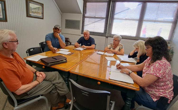 Megan Broome/The Clayton Tribune. Mountain City council members and officials discuss the "feasibility" of adopting zoning ordinances during a June 13 work session. 