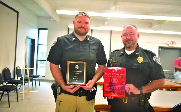 Megan Broome/The Clayton Tribune.  Clayton Police Department Sgt. William Wall and Chief Andy Strait were recognized for 10 years and 25 years of service respectively during Tuesday’s Clayton City Council meeting. Both officers were presented with appreciation plaques and honored during the meeting. 