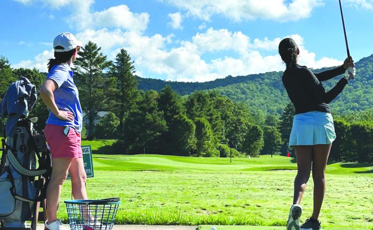 Submitted. Rabun Gap-Nacoochee’s Jade Blakeley (right) watches her tee shot. Blakeley was the low medalist.