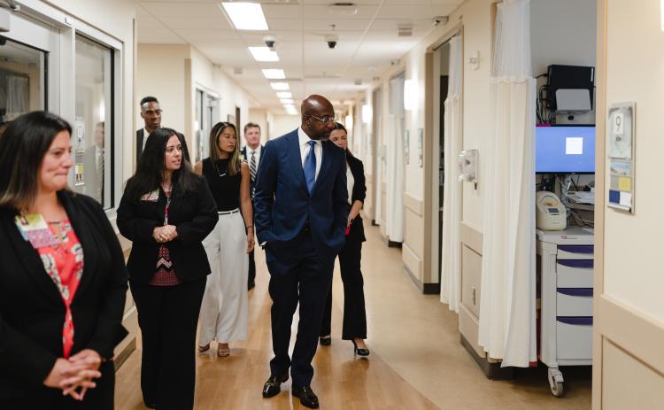 Submitted photo. While Sen. Raphael Warnock visited Northeast Georgia Medical Center in Gainesville on Aug. 8 to discuss the maternal health work Northeast Georgia Health System is doing, he received a tour of the neonatal intensive care unit.